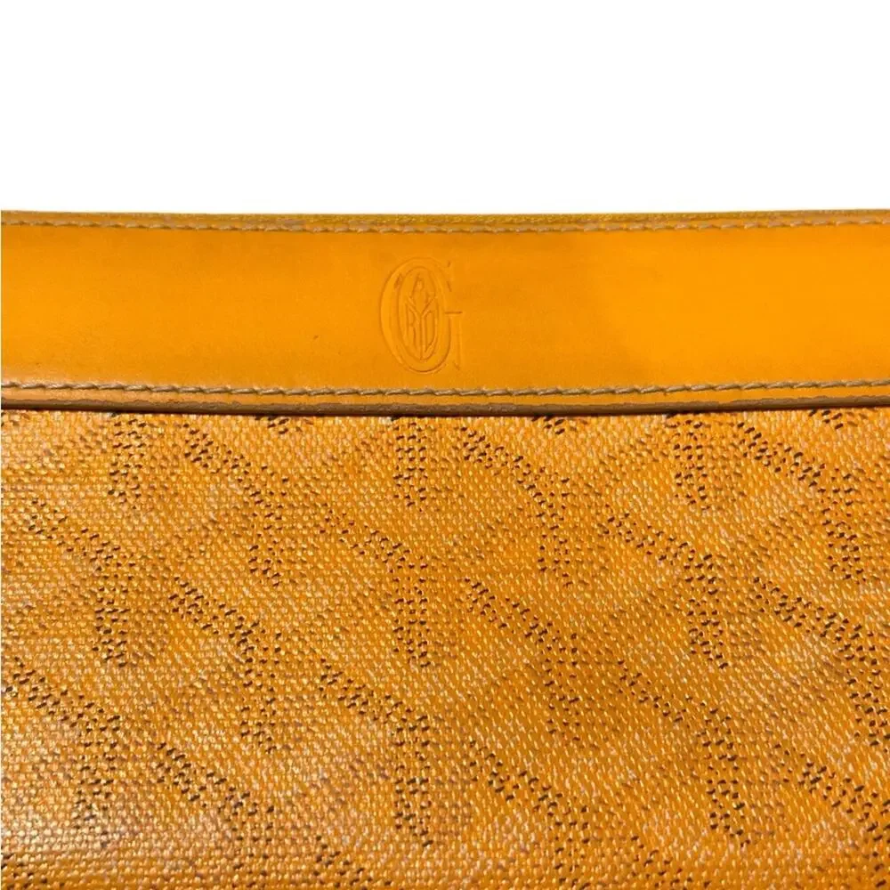 Goyard Matignon zip-around wallet in yellow orange Goyardine canvas.